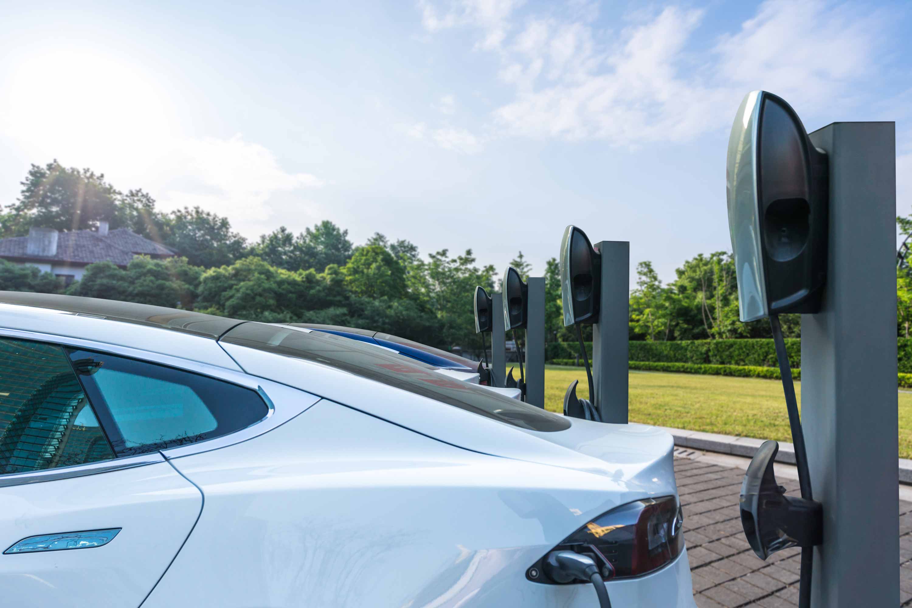 electric cars charging in a parking lot