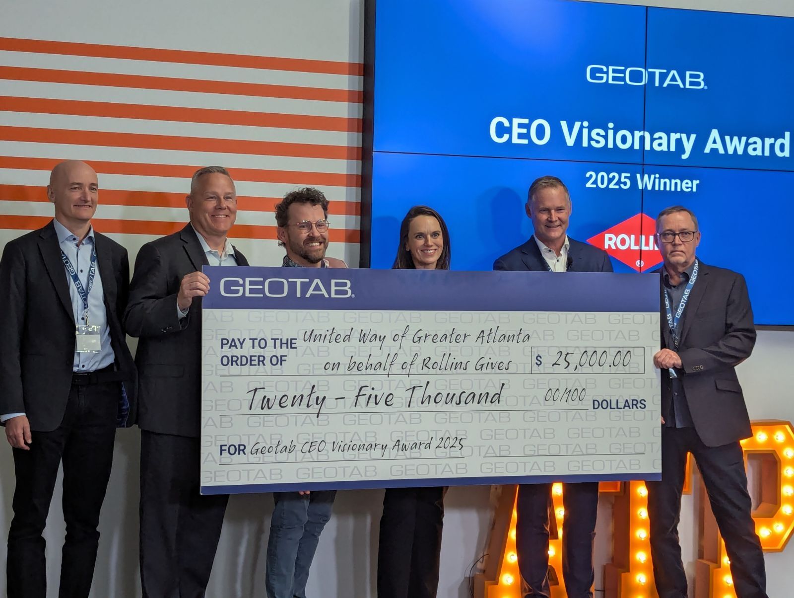 Geotab CEO Visionary Award $25,000 charitable donation cheque presentation Rollins and United Way of Greater Atlanta