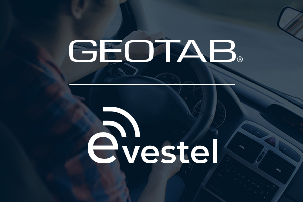 Geotab and Evestel logo on faded picture of a man driving a vehicle