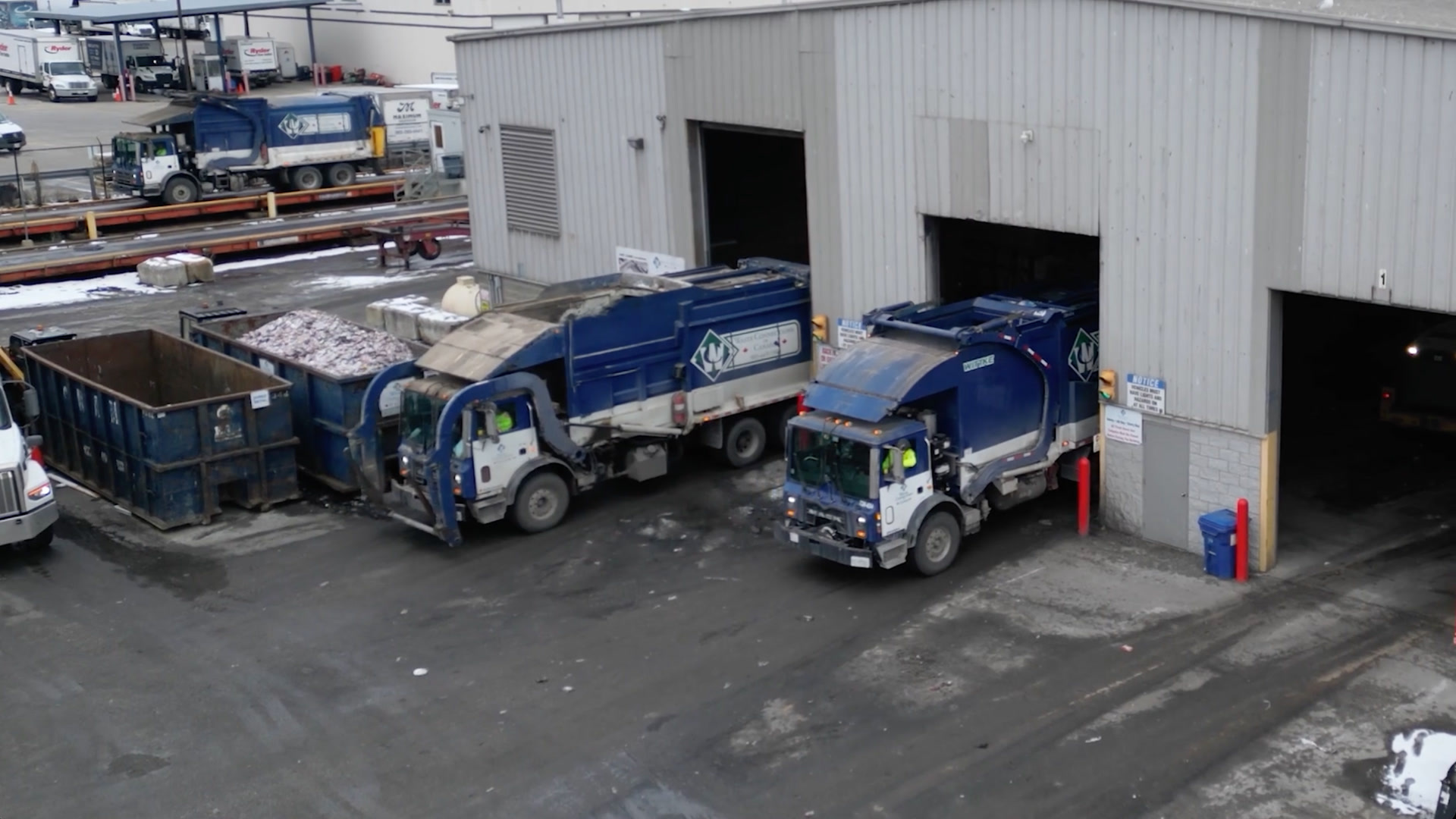 waste connections trucks backing into warehouse