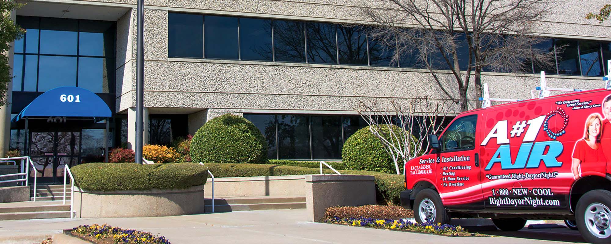 Red A#1 Air van parked outside the A#1 Air office building