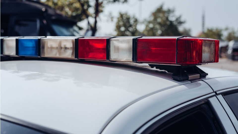 top of police car with lights in the frame