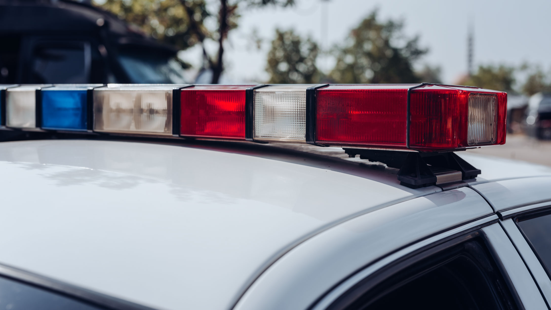 top of police car with lights in the frame