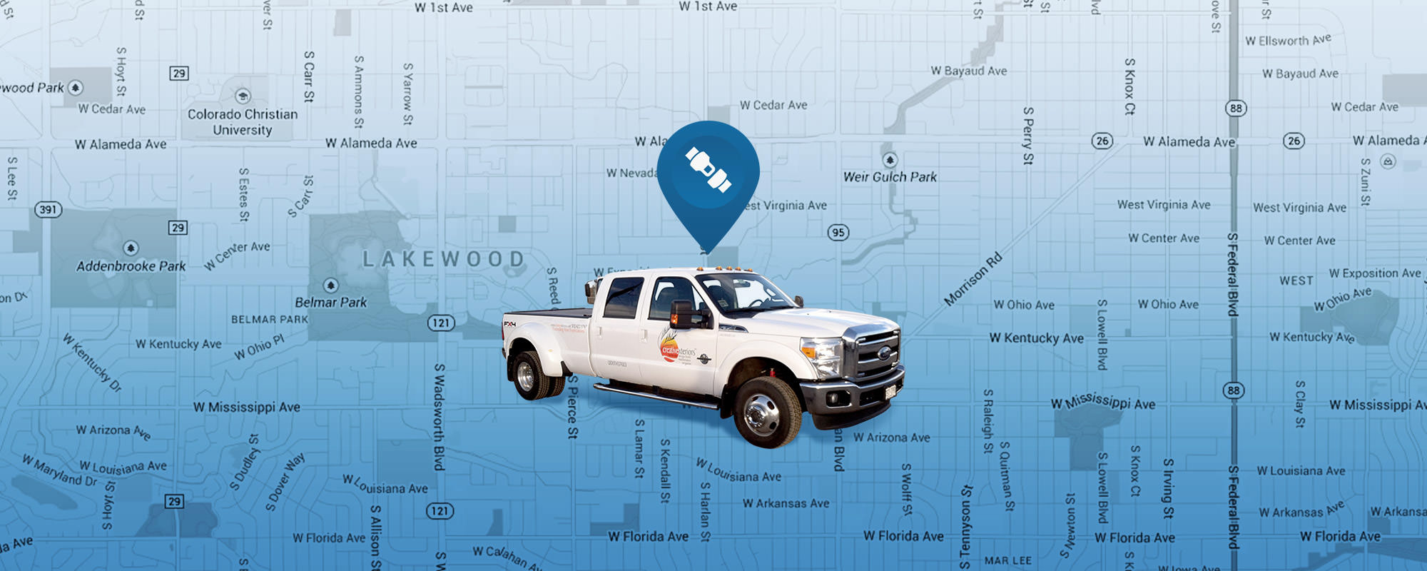 White CreativeXteriors pickup truck with blue GPS icon above it