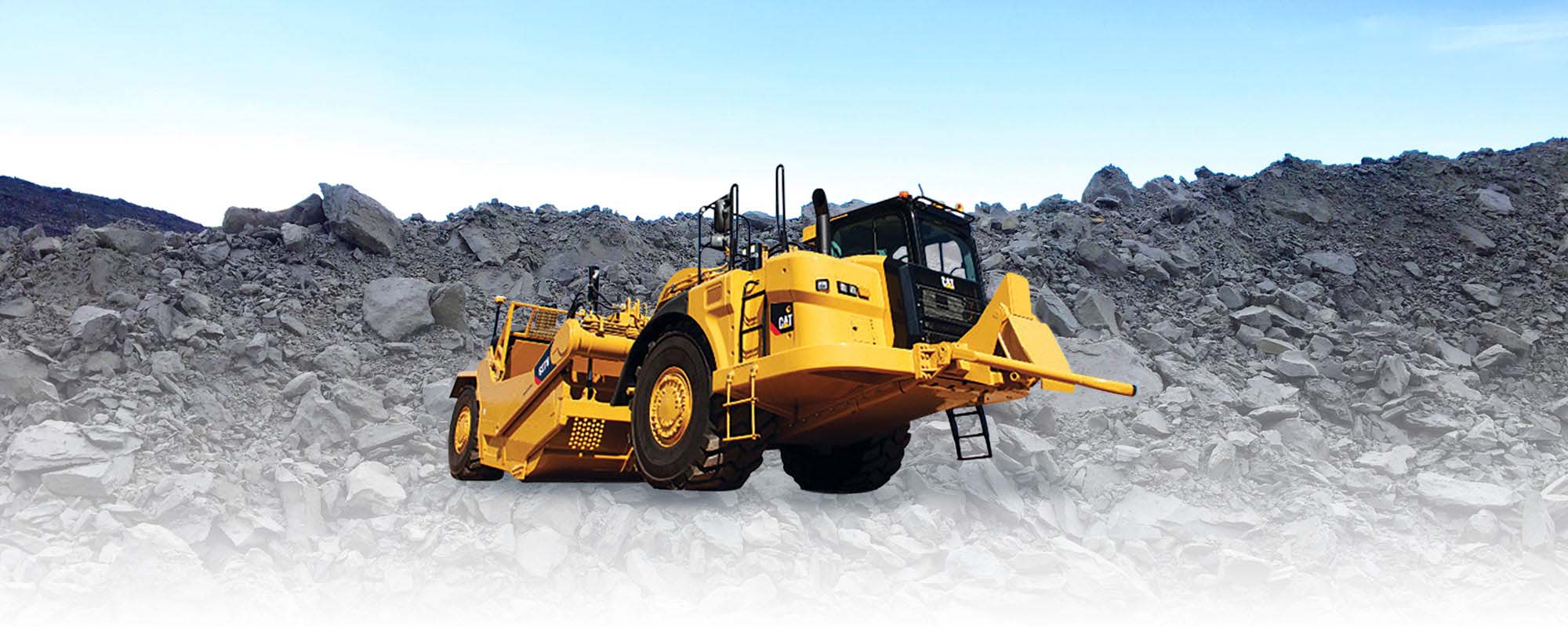 Yellow mining equipment with surface pit in background and company logo in left hand corner. 