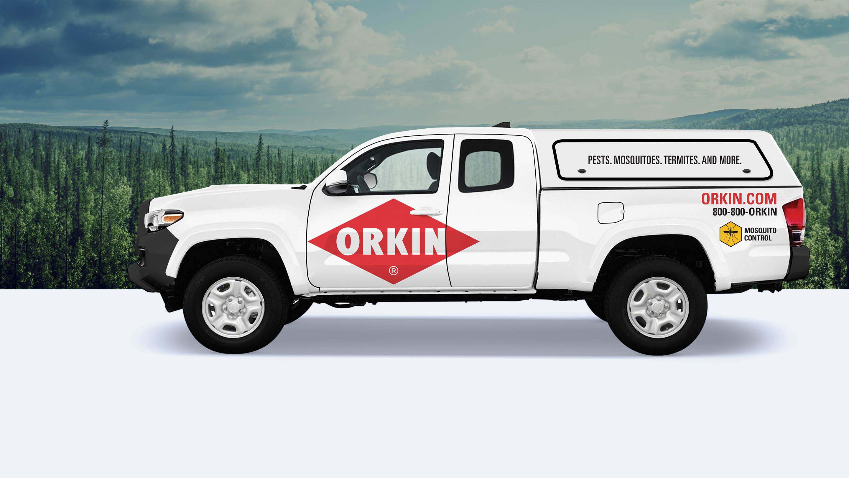 White truck with ORKIN logo on it