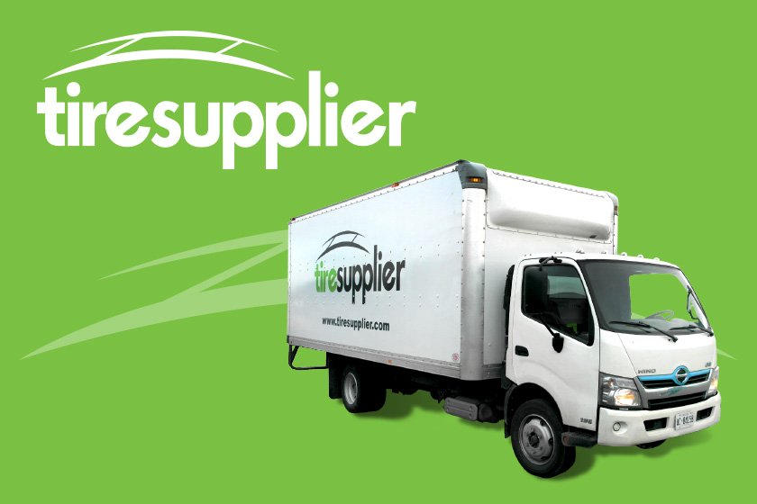 White Tire Supplier truck on a green background with Tire Supplier logo above it