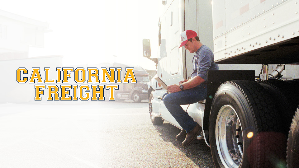 california freight logo with a person sitting on a truck working on laptop