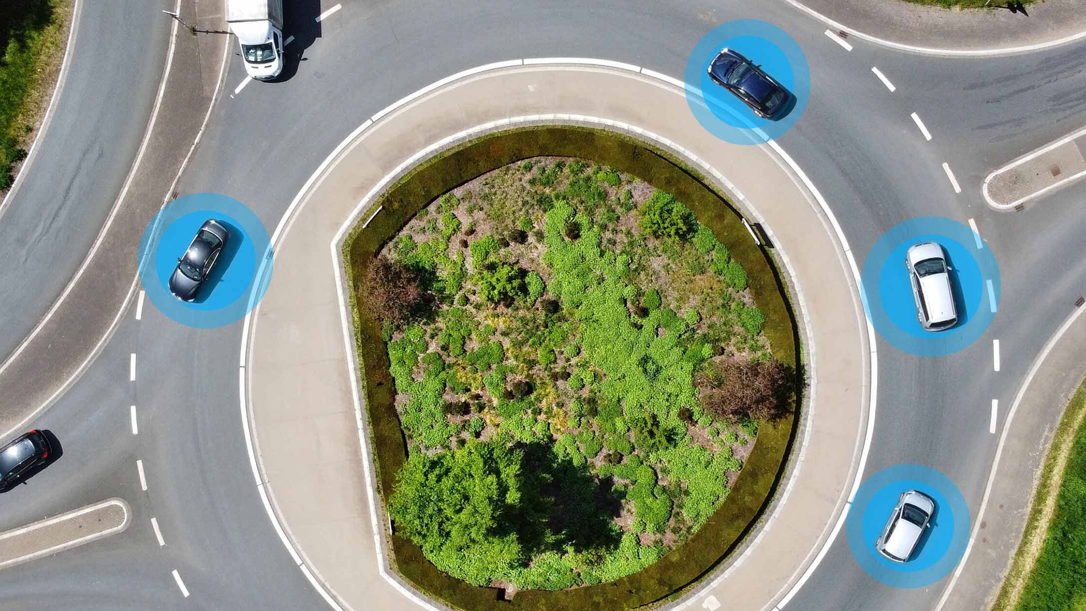 blue highlighted cars around a roundabout 