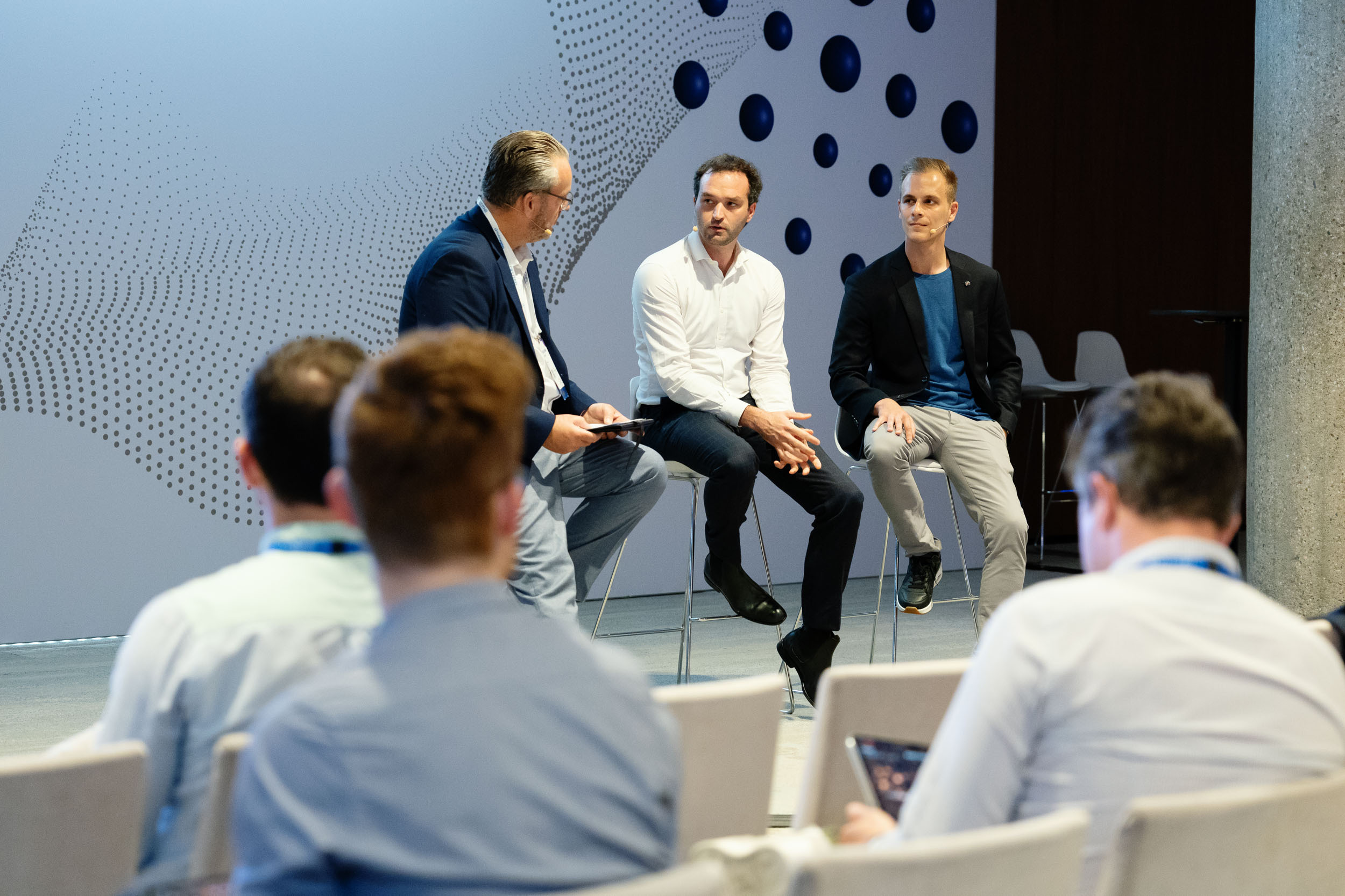 Speakers from Scania and Petit Forestier sitting and talking with Geotab during Connect Europe event