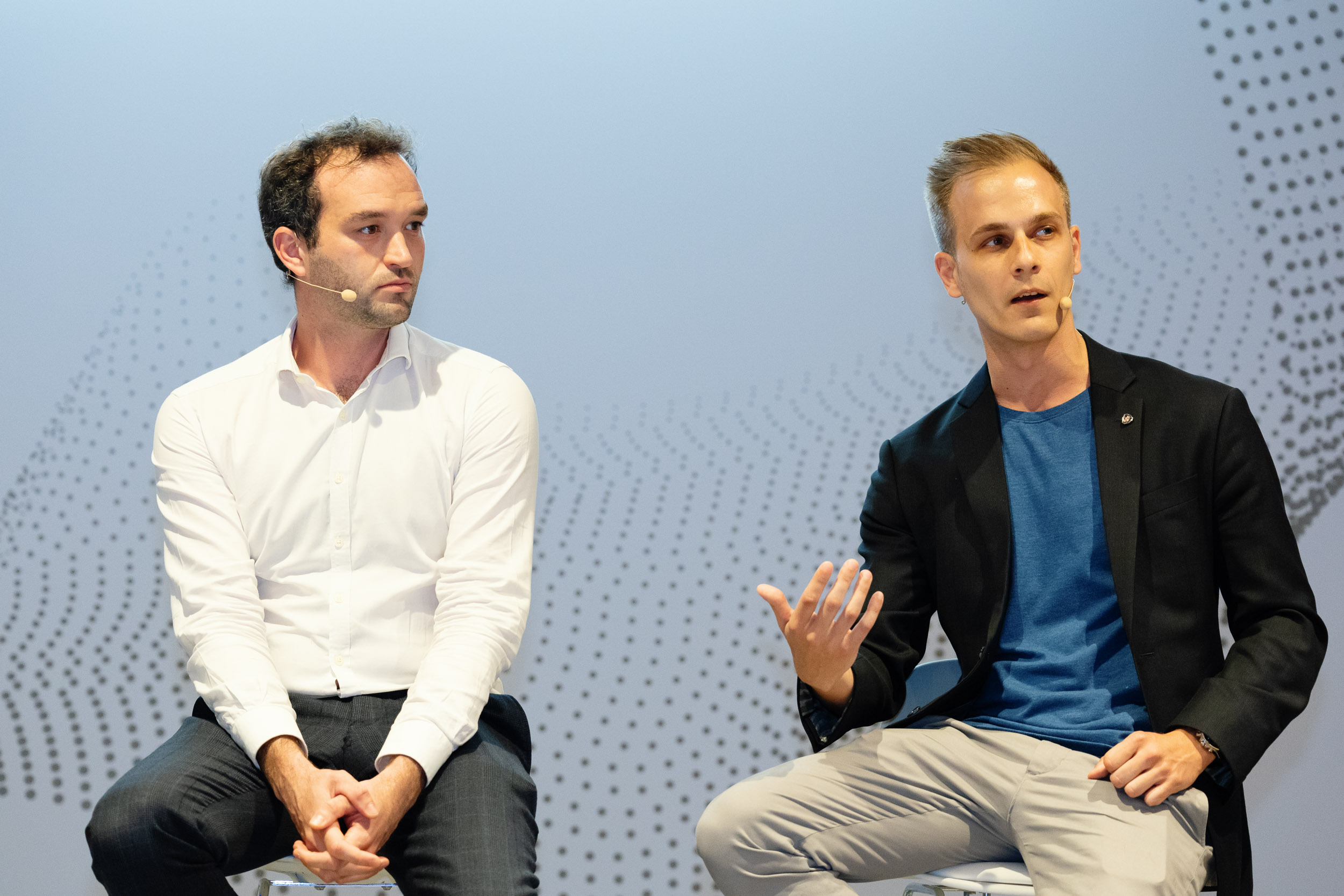 Professionals from Scania and Petit Forestier seated and speaking at a Geotab conference