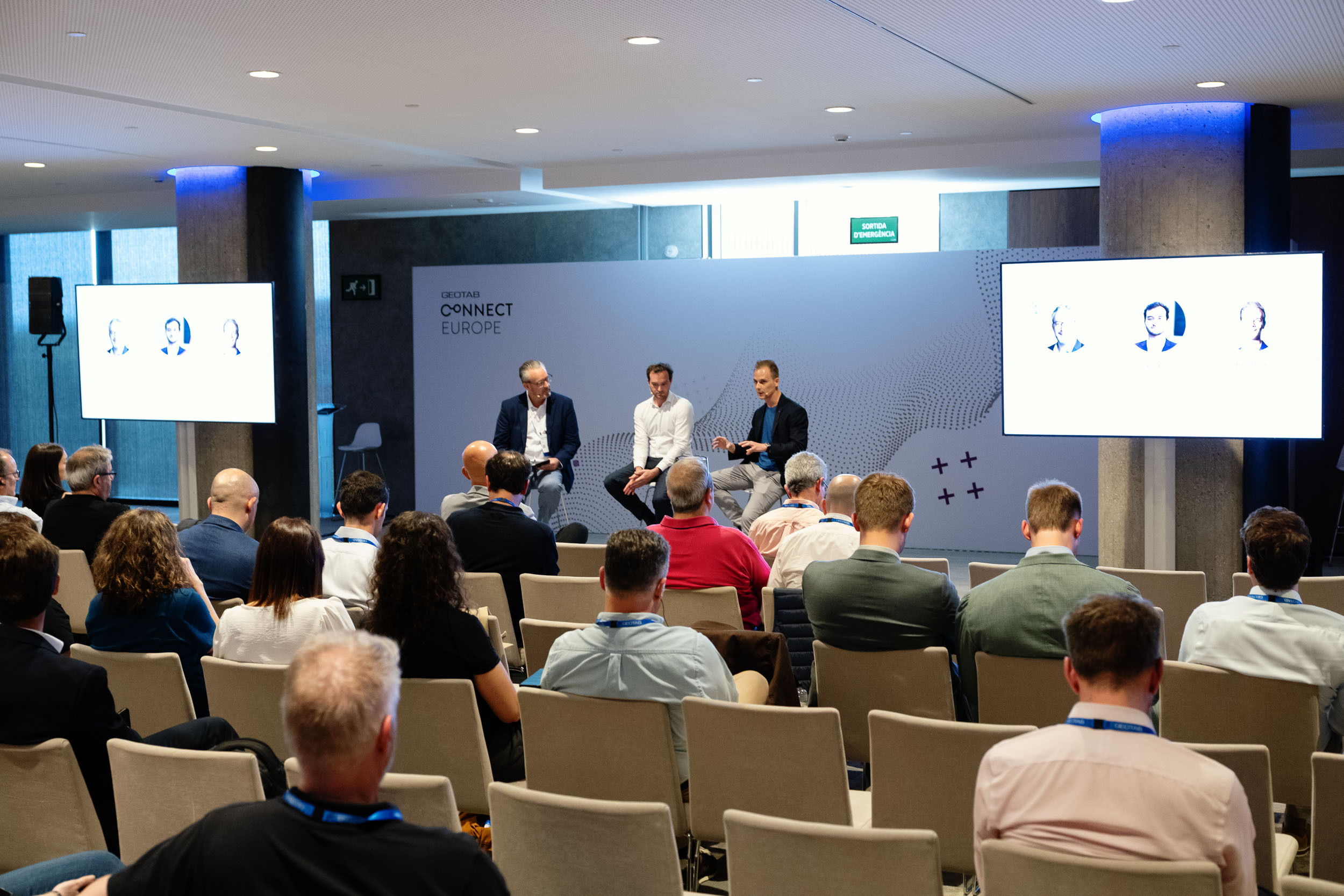 Three speakers at Connect Europe Event by Geotab, sitting and speaking in a panel