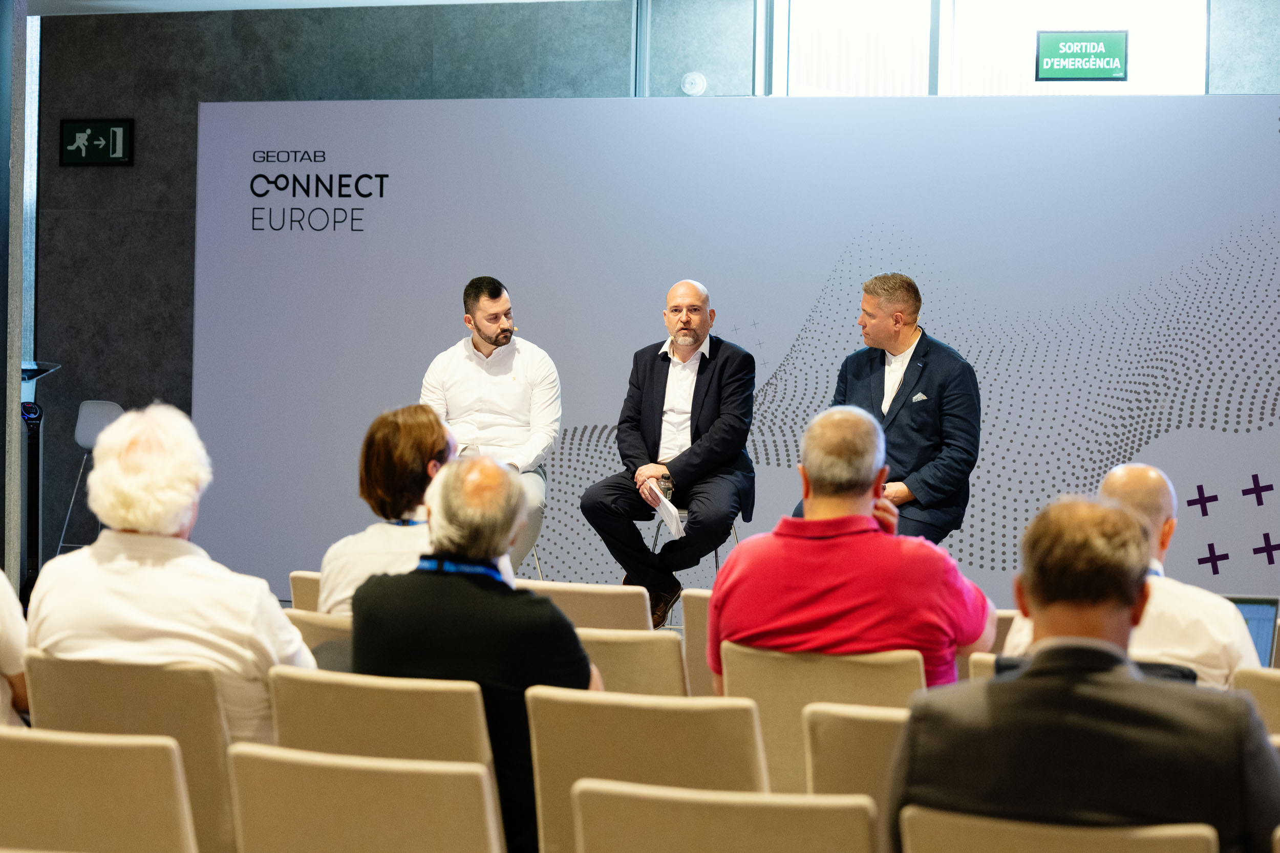 View of a panel at Connect Europe 2026 with three speakers seated, from the audience