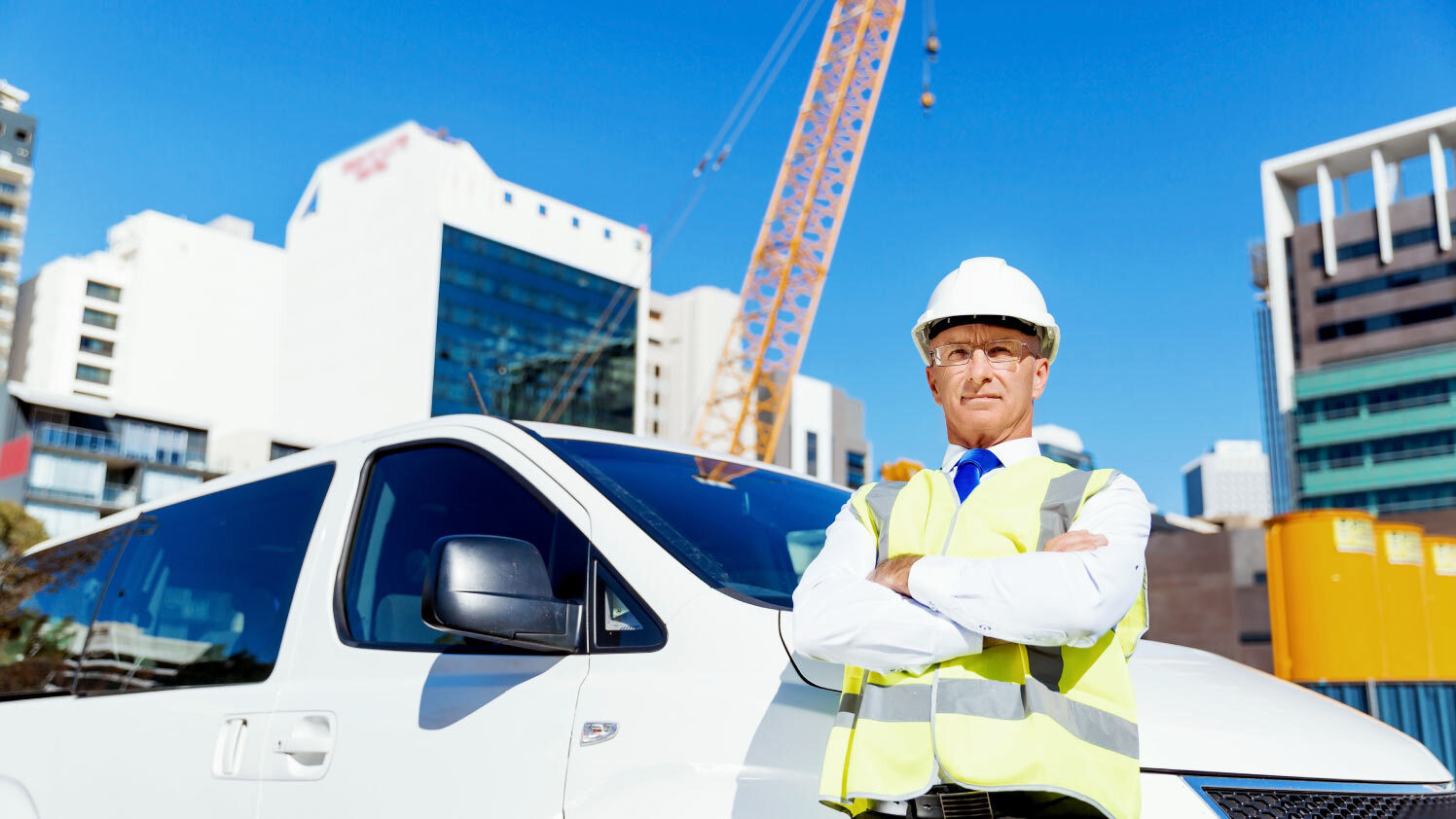 construction worker next to a van