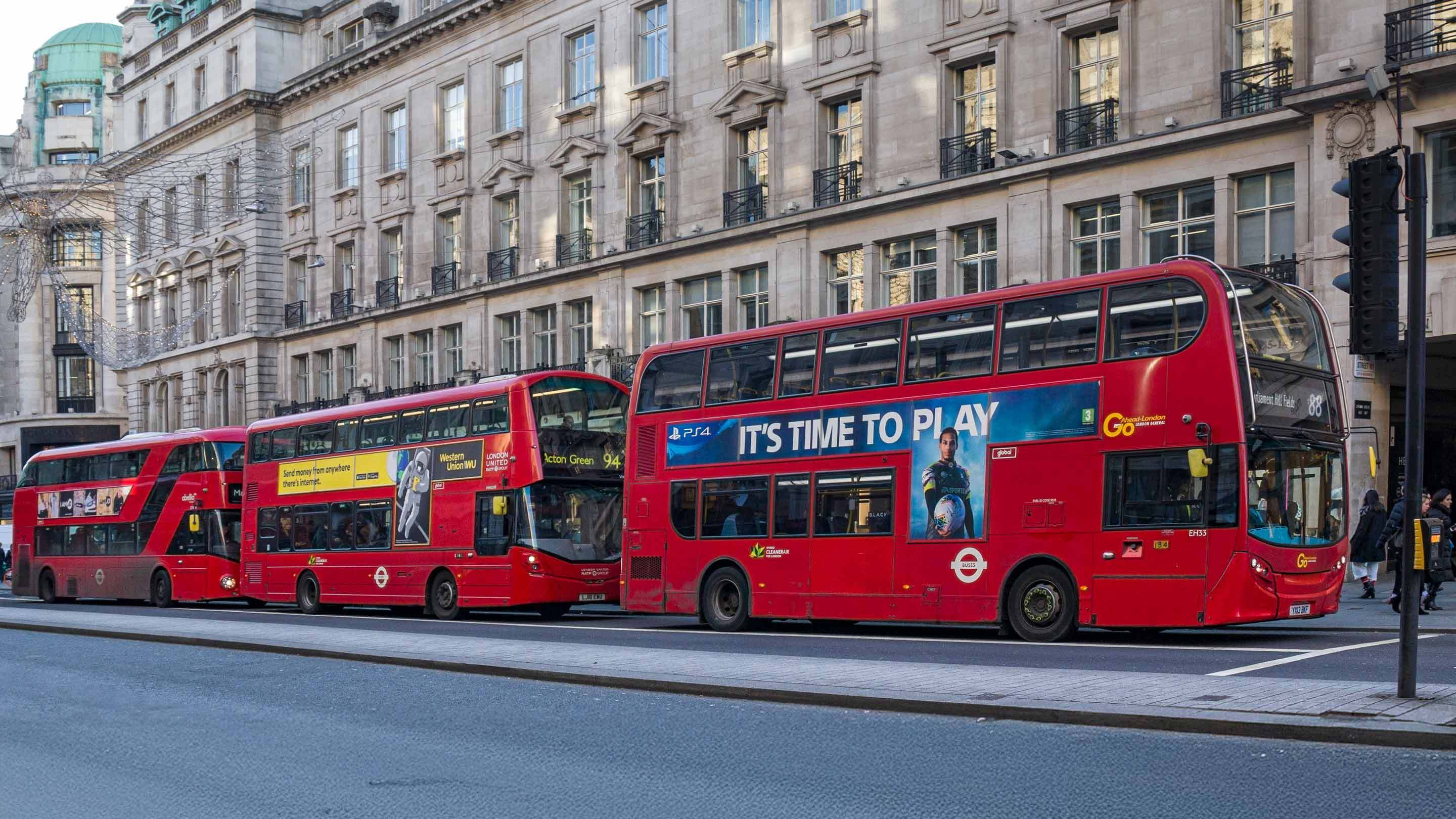 red double decker buses in a line