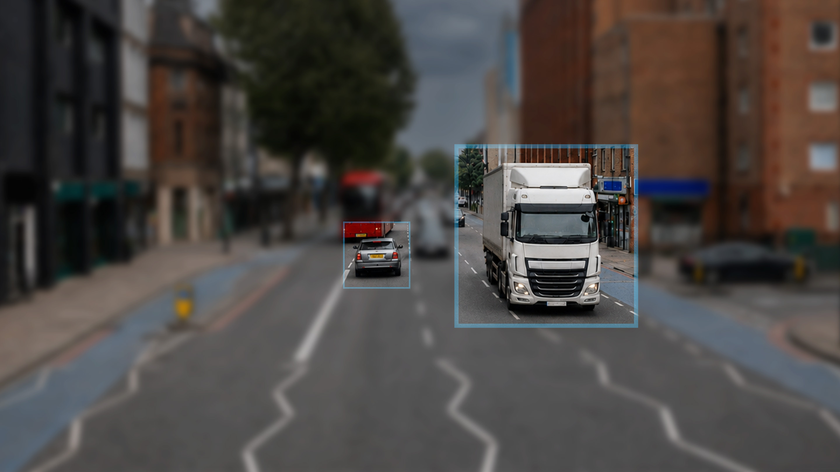 Commercial vehicles on a UK street, each highlighted by a telematics detection box.