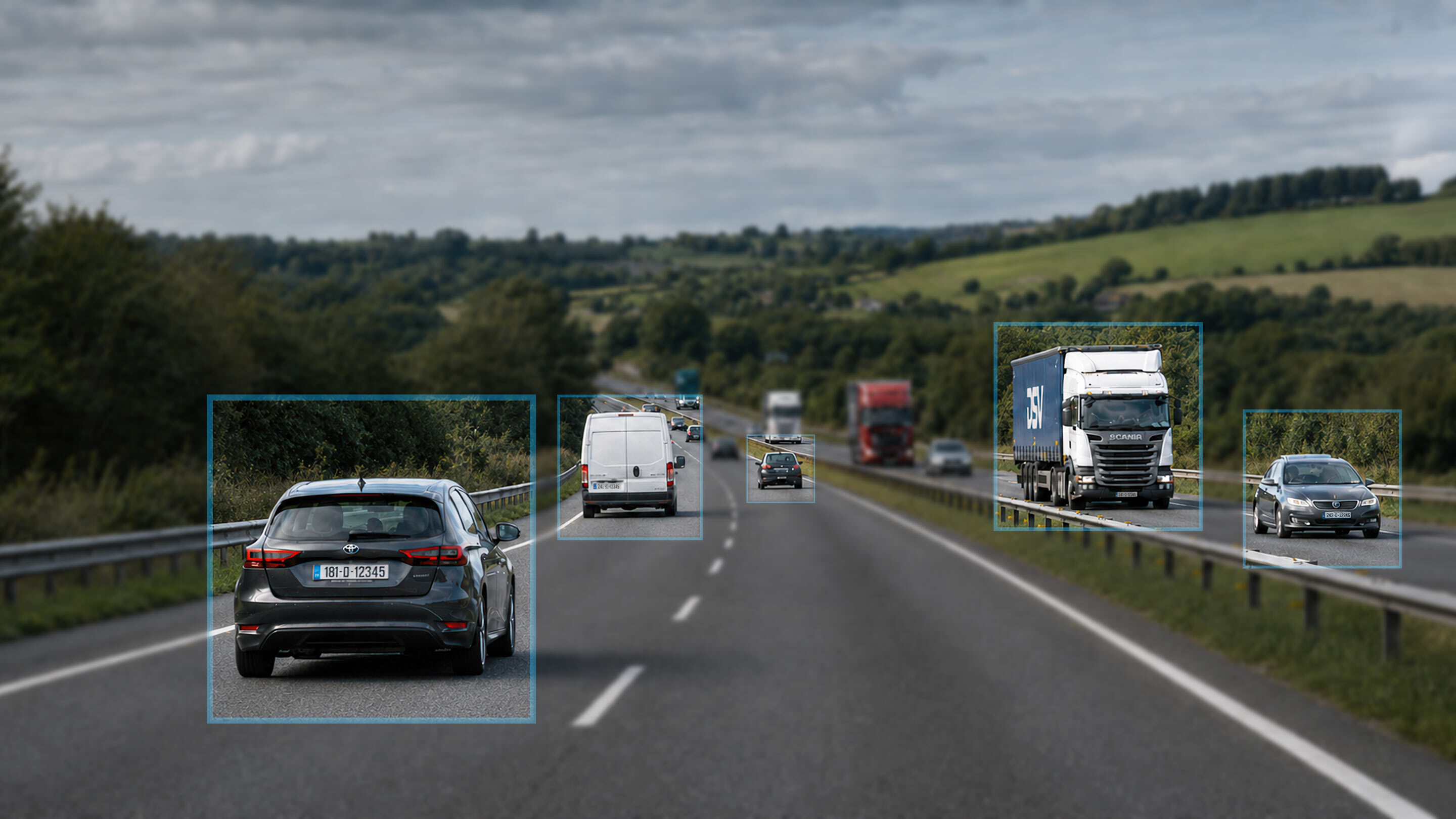 Commercial vehicles on an Irish street, each highlighted by a telematics detection box.