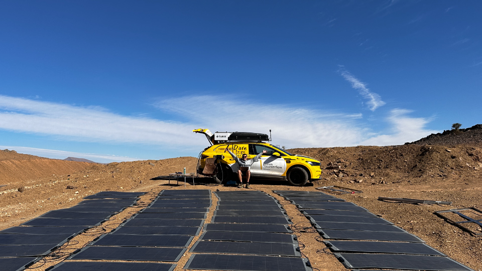 The 4x4electric vehicle charges the car with solar panels in the sun