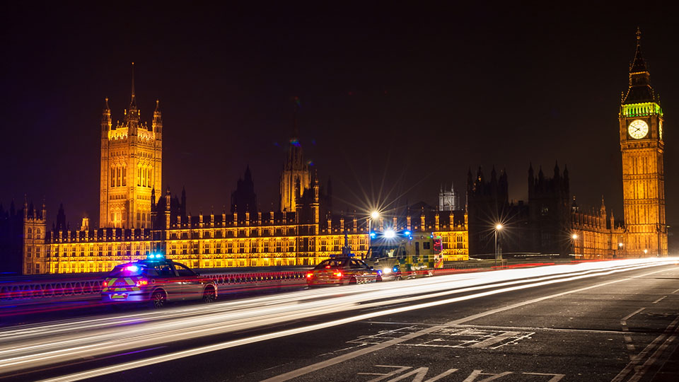 London at night with police cars