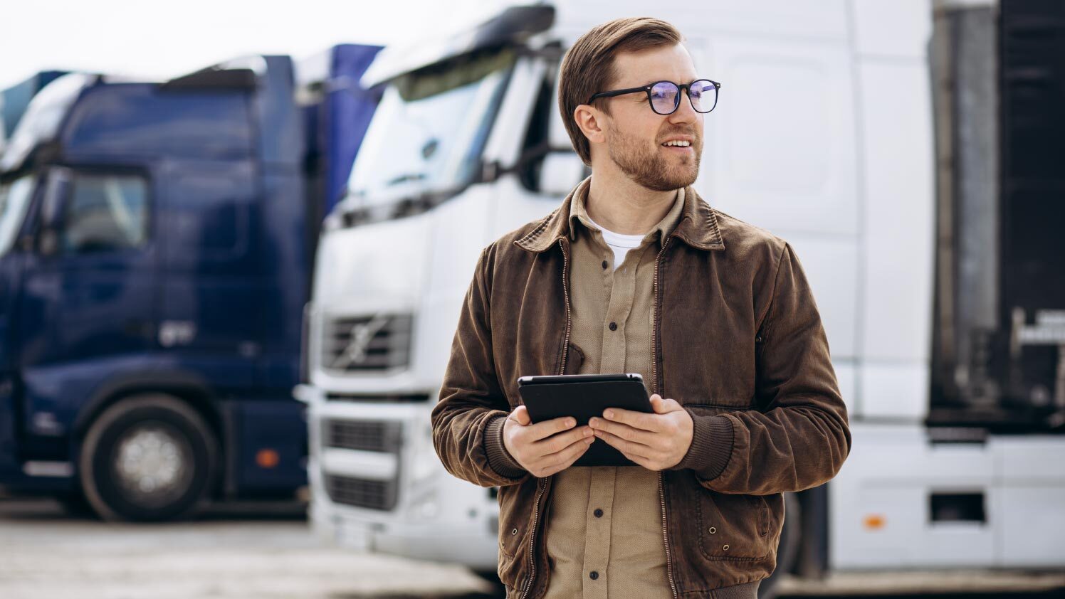 person standing in front of vehicles