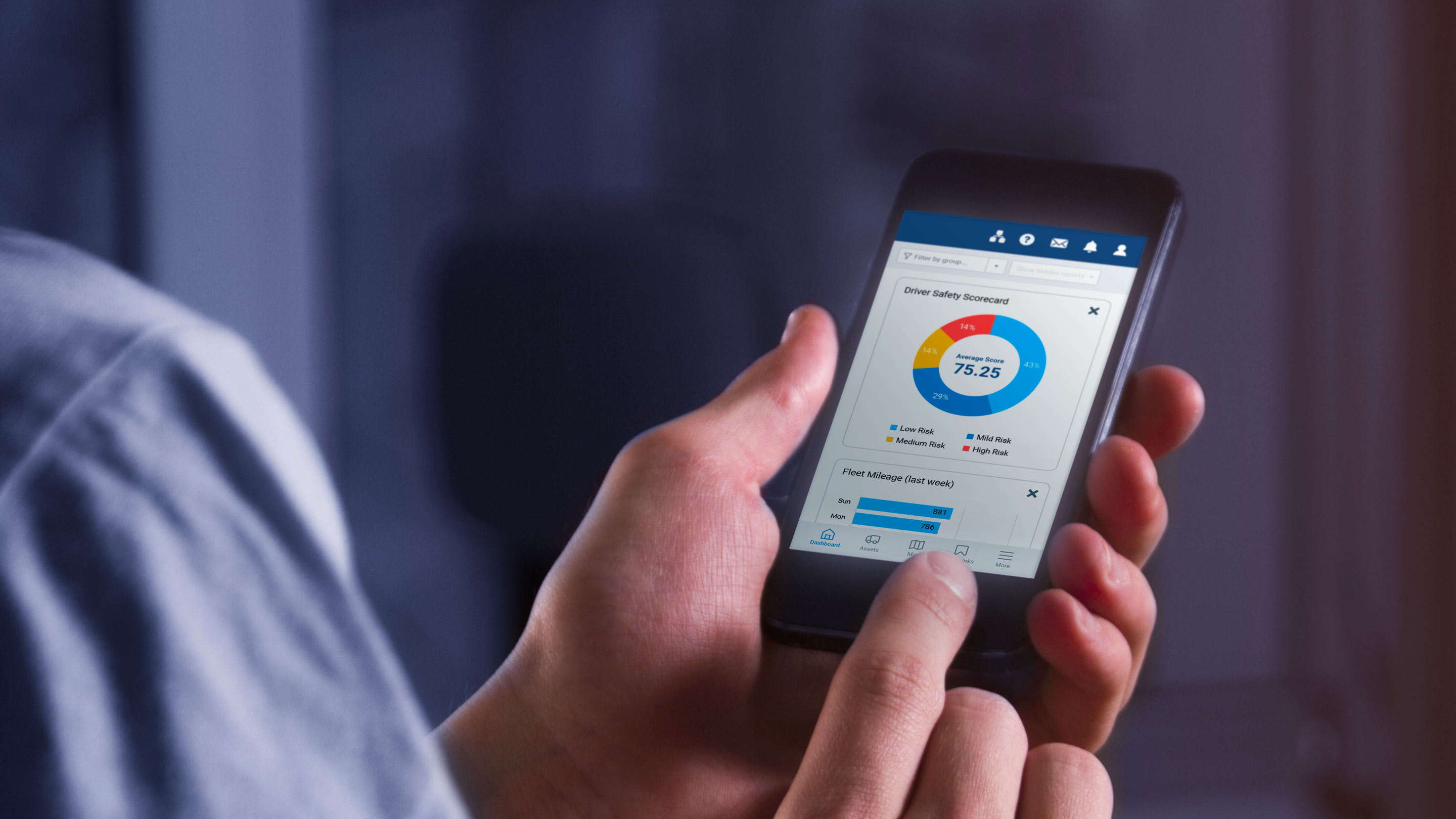 person holding a phone with MyGeotab